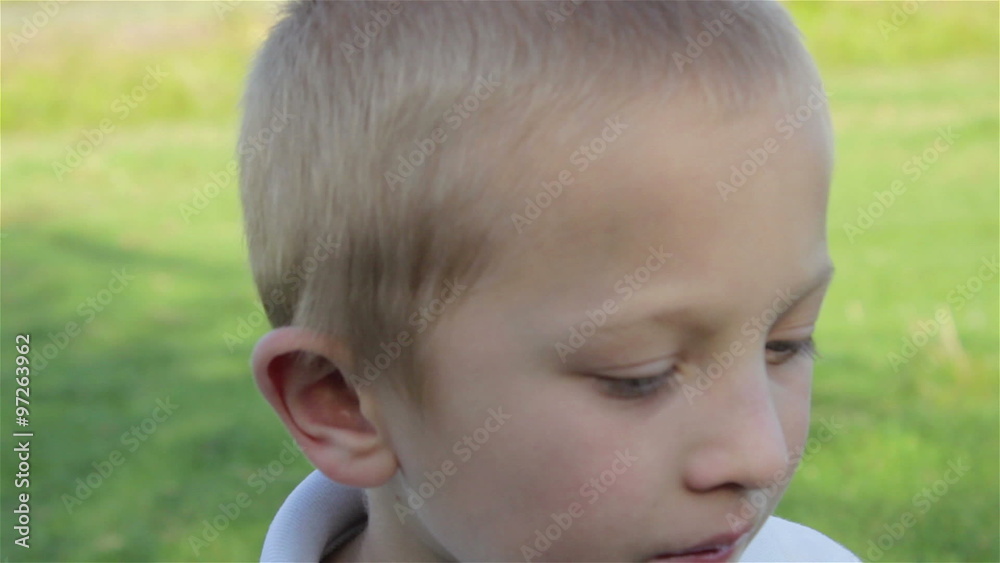 drink water from bottle/boy drinks water from a bottle in the summer when it's hot drink water from bottle/boy drinks water from a bottle in the summer when it's hot