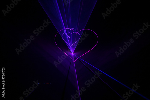 Expensive stylish laser show with light beams glow hearts at wed