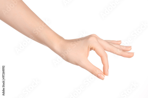 Beauty and Health theme: beautiful elegant female hand show gesture on an isolated white background in studio photo