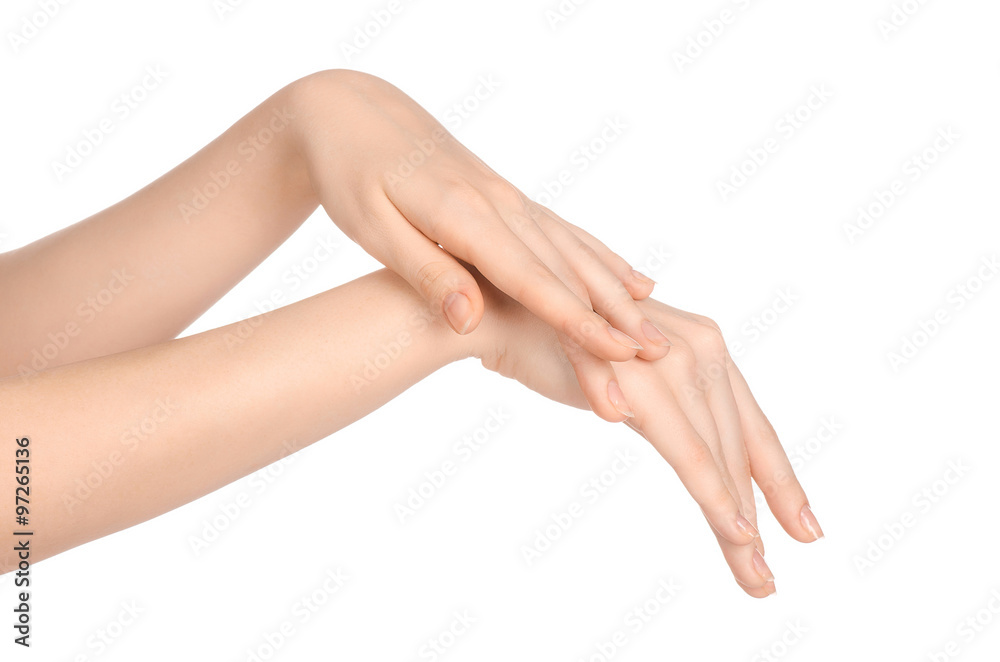 Beauty and Health theme: beautiful elegant female hand isolated on a white background in the studio, using cream advertisement, massage