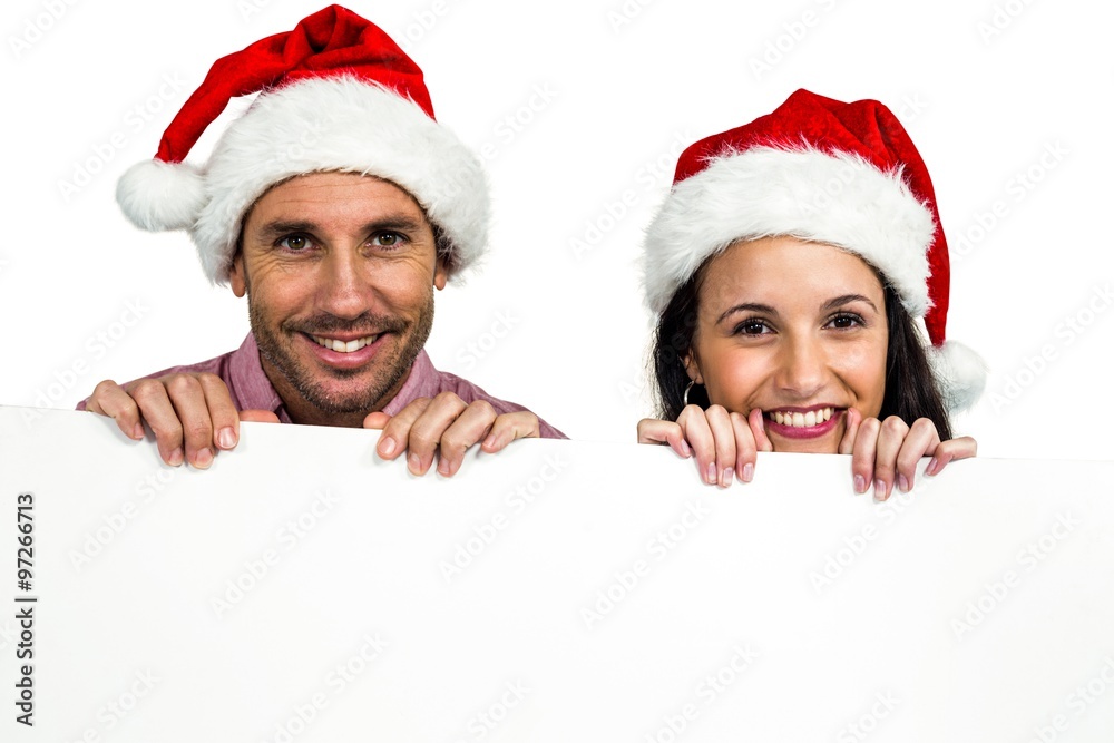 Festive couple showing a sign Festive couple showing a sign