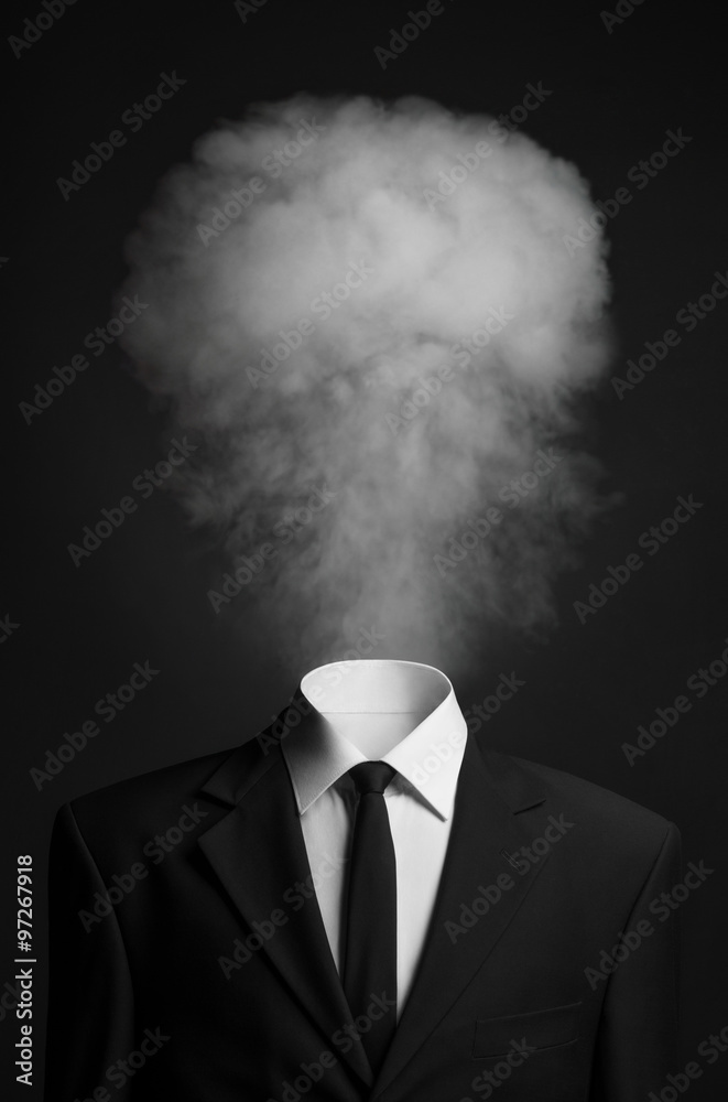 Surrealism and business topic: the smoke instead of a head man in a black suit on a dark background in the studio - obrazy, fototapety, plakaty 