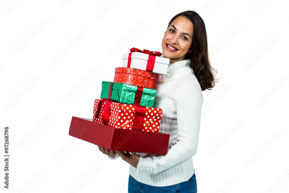 Festive brunette smiling with gifts Festive brunette smiling with gifts
