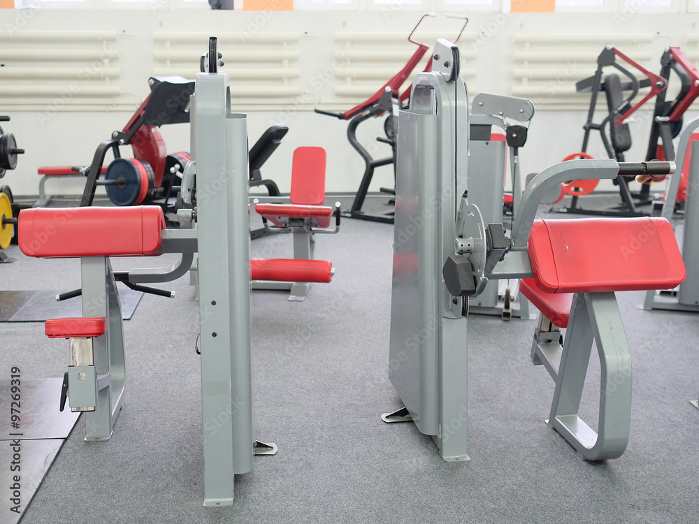 Fototapeta premium Interior of new modern gym with equipment