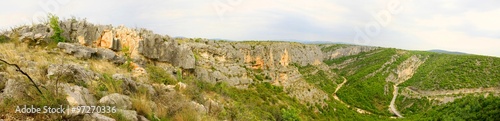 Rocky cliffs and road in Čikola canyon in Dalmatia, Croatia