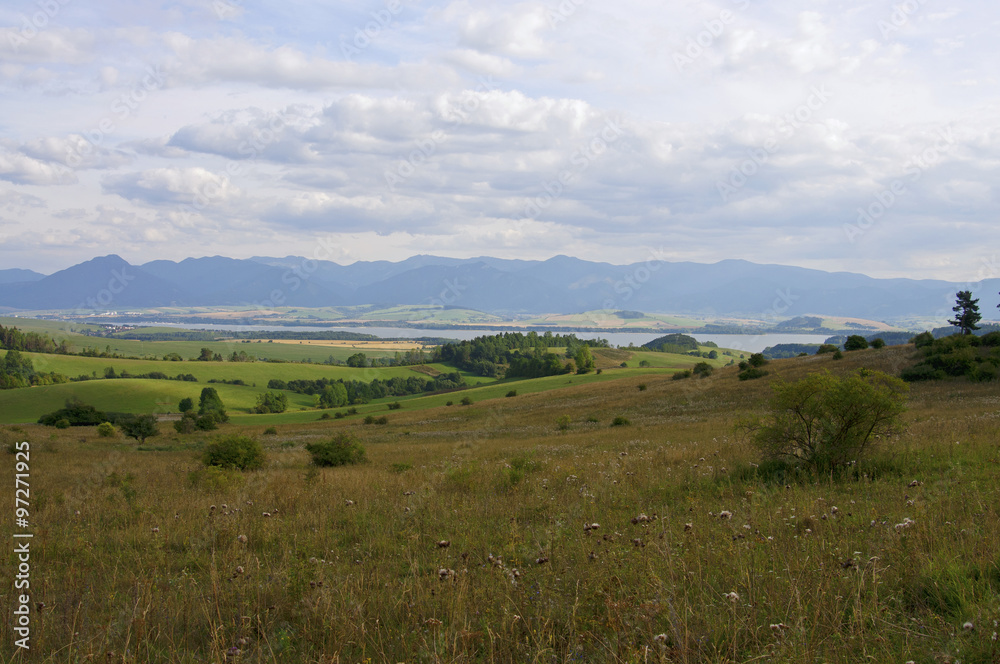 Mountain and lake in distance landscape Mountain and lake in distance landscape