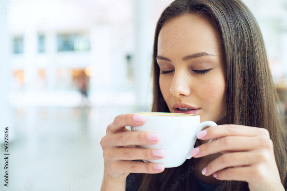 woman drinking coffee in the morning at restaurant soft focus. woman drinking coffee in the morning at restaurant soft focus.