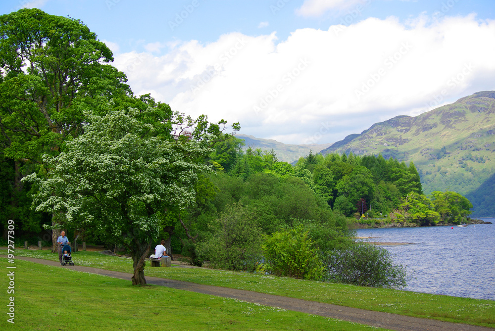 LOCH LOMOND LAKE, SCOTLAND - June, 2013: Embankment of the lake LOCH LOMOND LAKE, SCOTLAND - June, 2013: Embankment of the lake