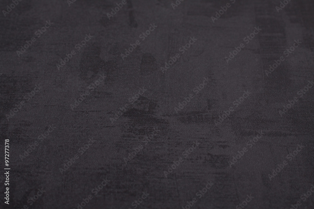 Black grainy stone background.