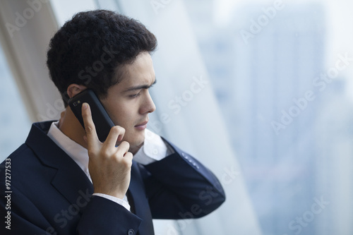 Businessman got a bad news on the phone.