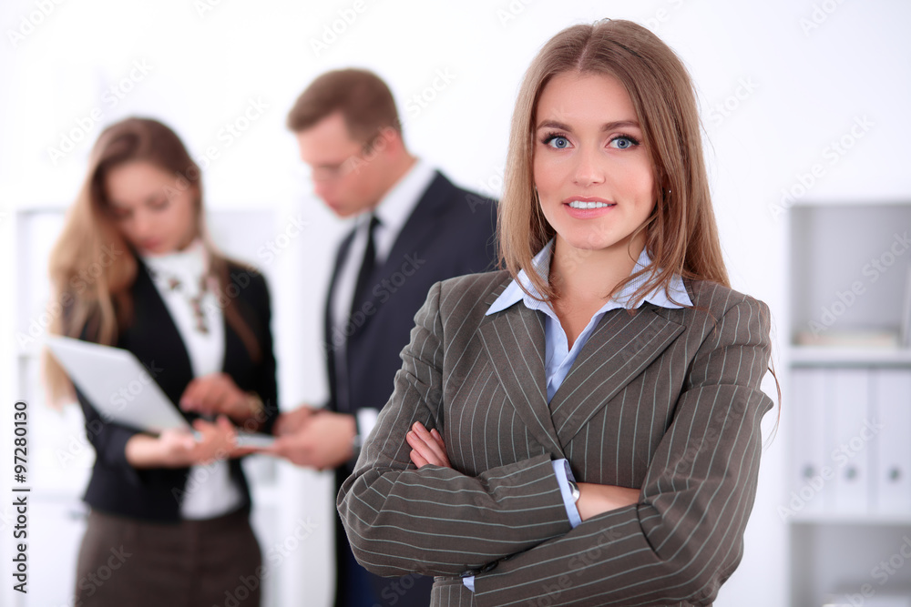 Face of beautiful cheerful smiling business woman on the background of business people Successful business concept Face of beautiful cheerful smiling business woman on the background of business people Successful business concept