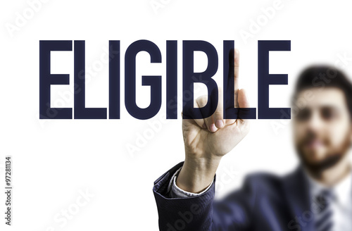 Business man pointing the text: Eligible photo