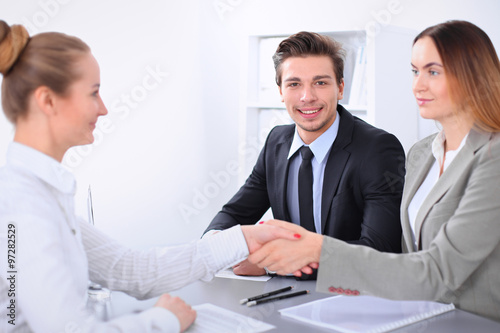 Business people shaking hands, finishing up a meeting