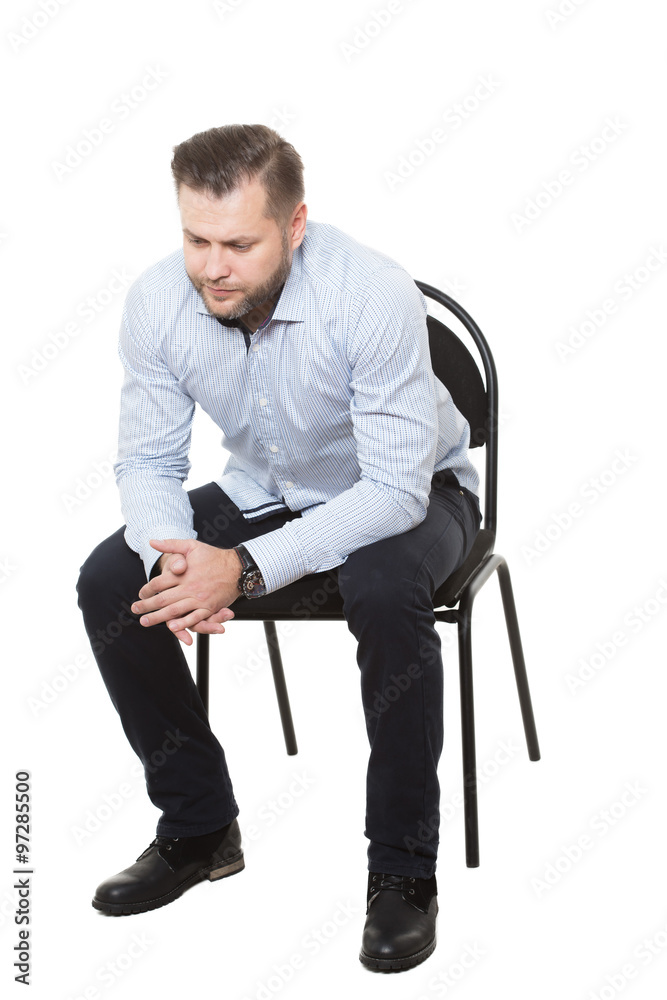 man sitting on chair. Isolated white background. Body language. gesture.  rubbing hands Stock Photo | Adobe Stock