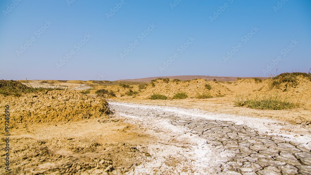 Desert Road With Hardened Volcano Mud At The Valley Desert Road With Hardened Volcano Mud At The Valley