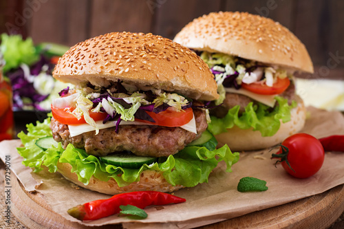 Sandwich hamburger with juicy burgers  cheese and mix of cabbage
