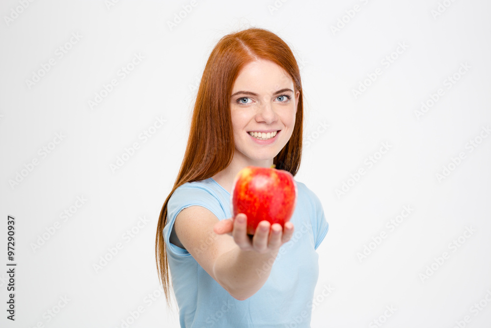 Smiling happy attractive lady holding an apple Smiling happy attractive lady holding an apple