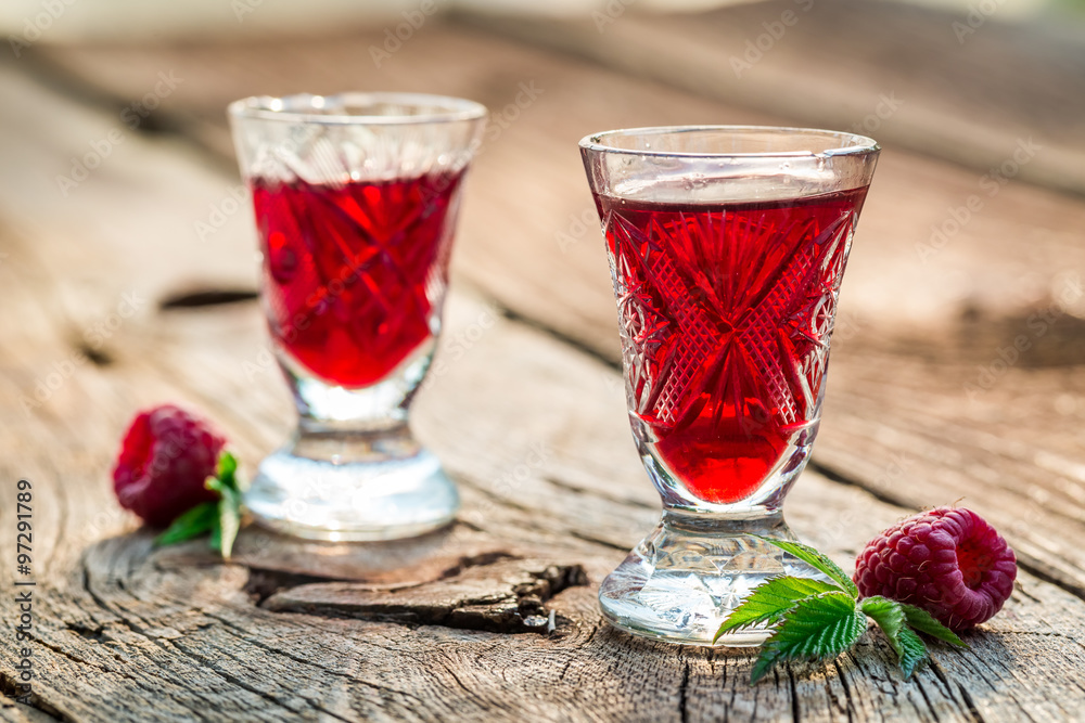 Homemade liqueur with alcohol and raspberries Homemade liqueur with alcohol and raspberries