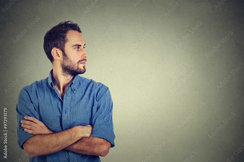 Side profile young man looking at his side