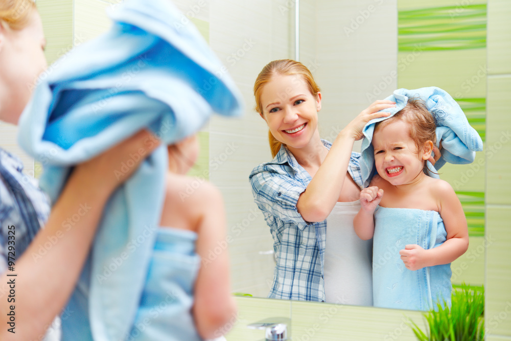 happy family in bathroom. mother of a child with towel dry hair Stock Photo  | Adobe Stock