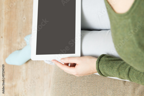 Woman using digital tablet detail