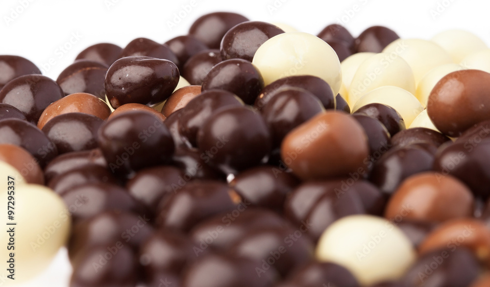Fototapeta premium small chocolate balls closeup on a white background