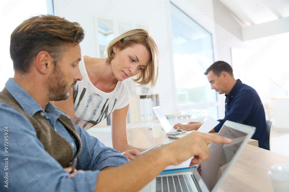 Business people working together in office Business people working together in office