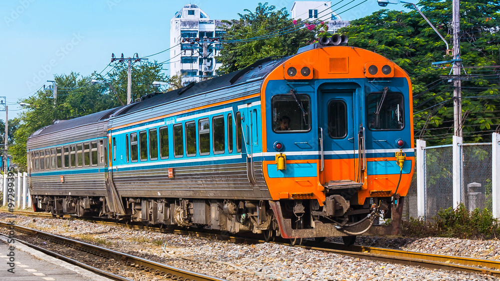 Intercity railcar set was arrivting station.

Thailand - 2013, Southern line intercity railcar set was arrivting Bangsue junction, Bangkok. (Taken form public platform.)