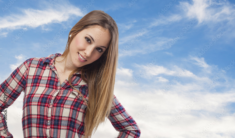 beautiful young woman posing and wearing plaid shirt
