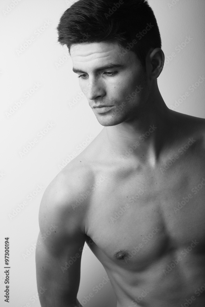 Fototapeta premium Handsome naked torso gy model studio portrait