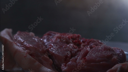 Juicy piece of meat cut with an ax