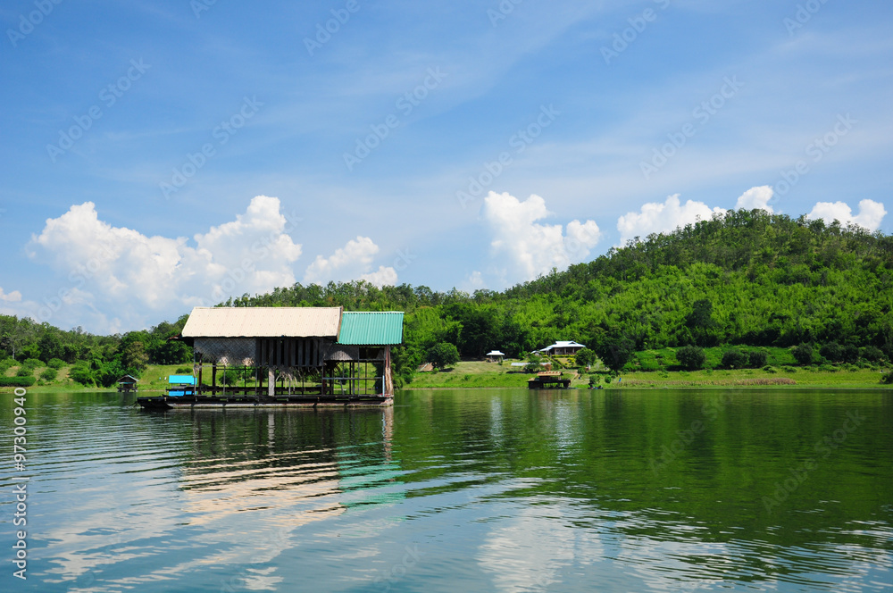 Houseboat, lake, moutain and sky in Thailand