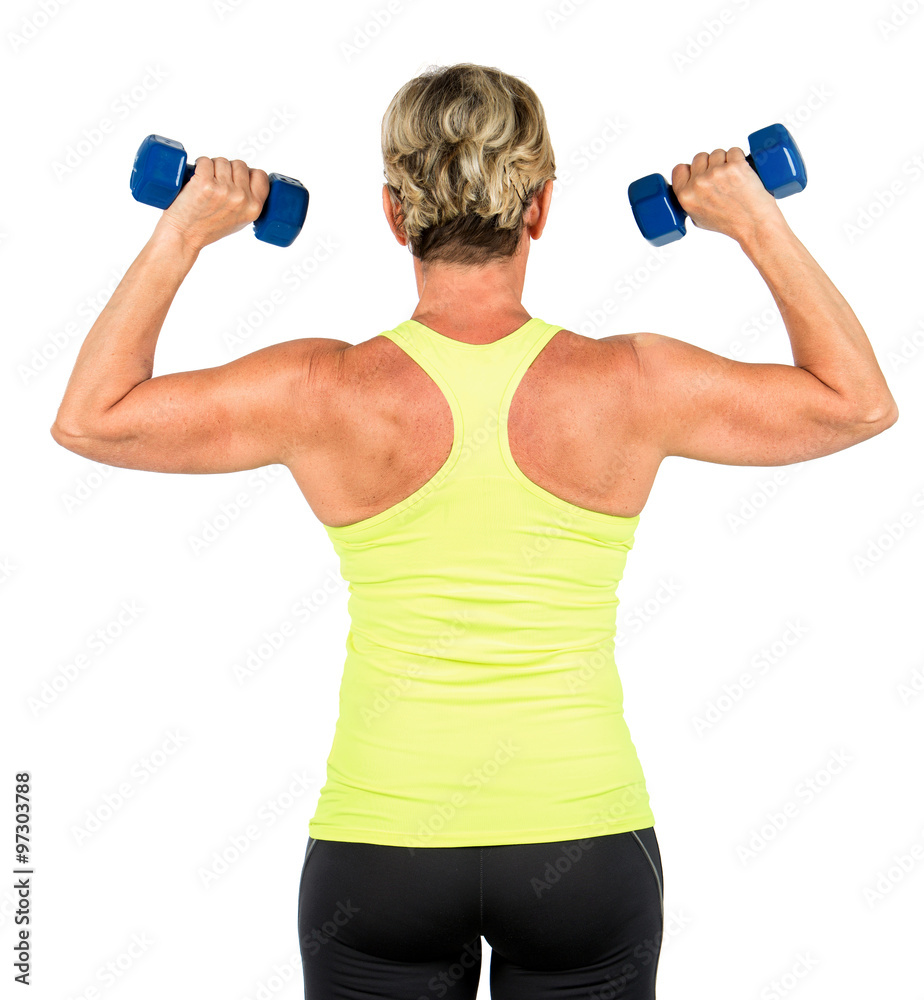 woman doing arms exercises with dumbbell woman doing arms exercises with dumbbell
