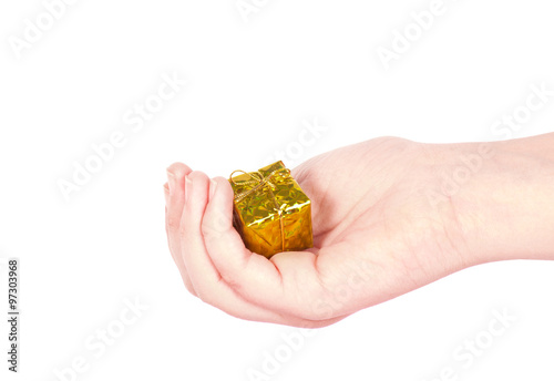 A hand holding a small box