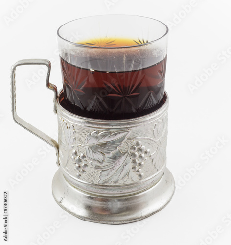 Glass of russian tea in vintage glass holder podstakannik