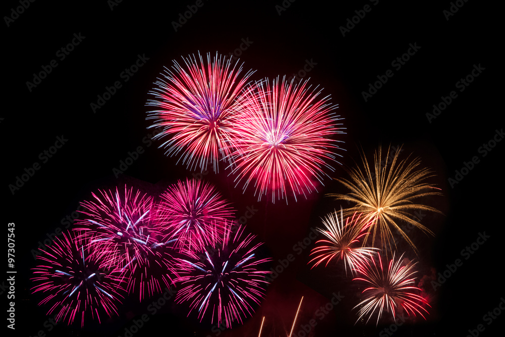 Colorful fireworks over night sky,red fireworks lines in black b