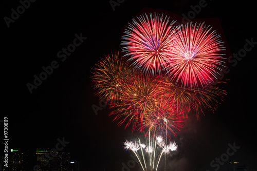 Colorful fireworks over night sky red fireworks lines in black b