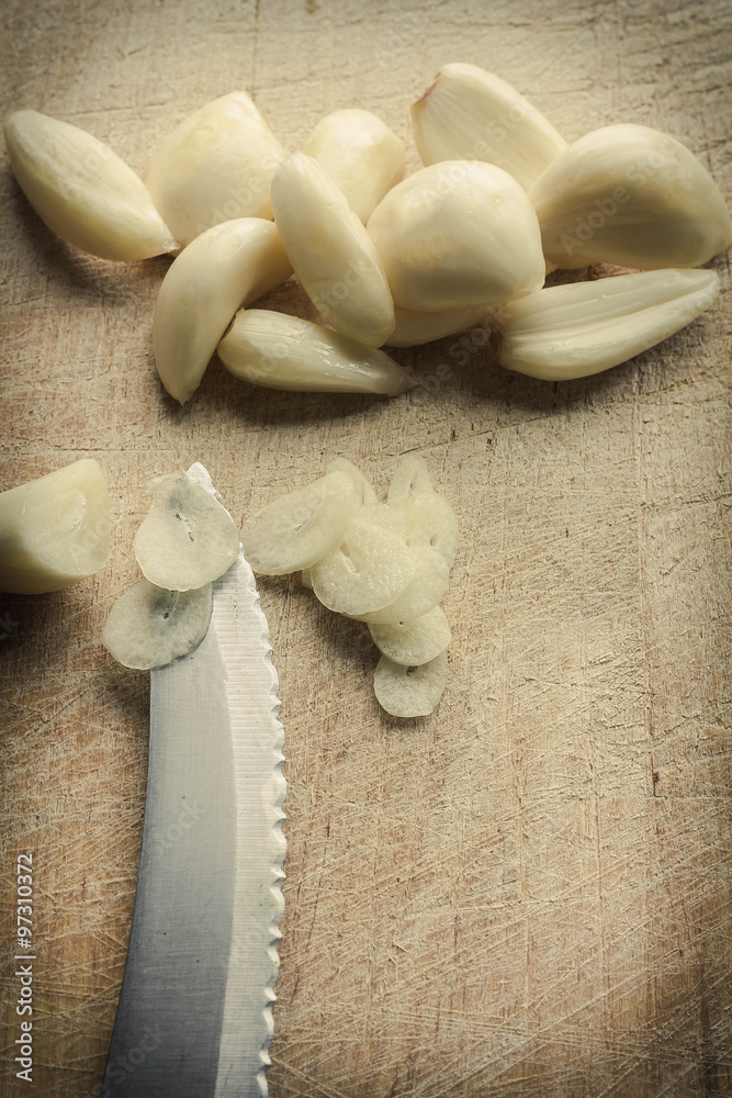 Slicing Fresh Pealed Garlic Cloves Slicing Fresh Pealed Garlic Cloves