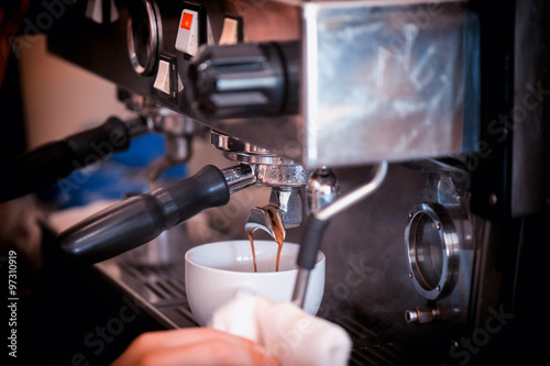 preparing coffee in cafe