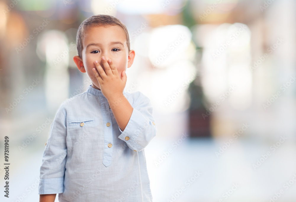 portrait of a little boy with surprised gesture