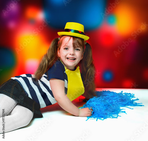 Portrait of little girl in carnival costume on abstract backgrou