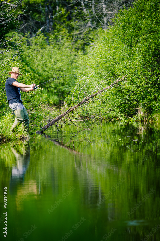 Young Fisherman Catching a big Fish Young Fisherman Catching a big Fish