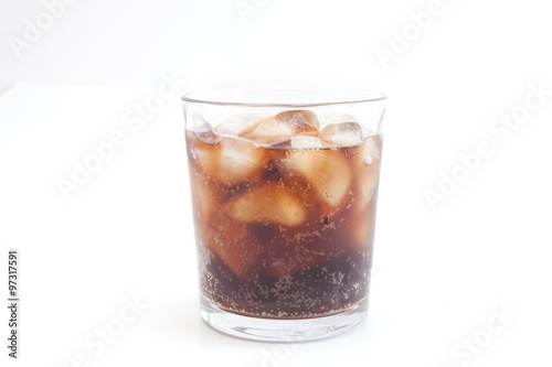 Cola with ice and lemon in a glass beaker