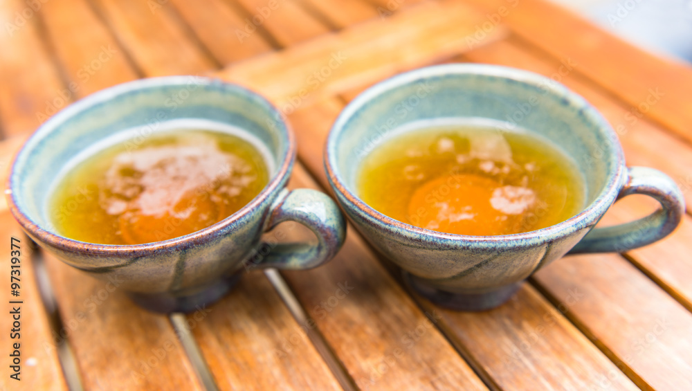 Norman apple cider in a typical ceramic cups Norman apple cider in a typical ceramic cups