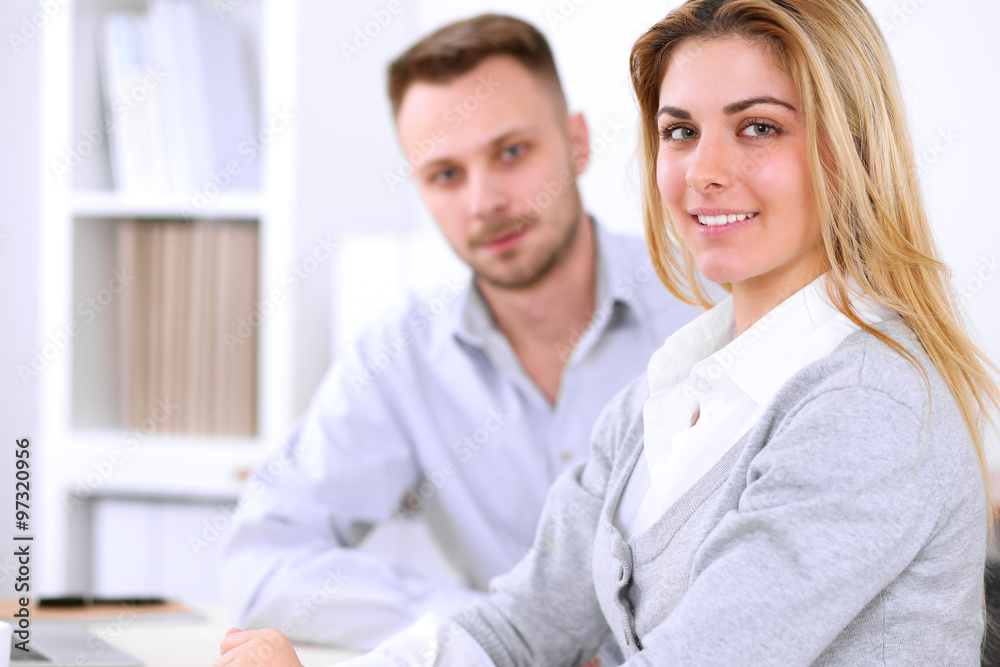 Two successful business partners working at meeting in office Two successful business partners working at meeting in office