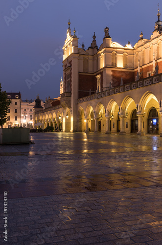 Cloth-hall (Sukiennice) in Krakow illuminated in early morning #97324740