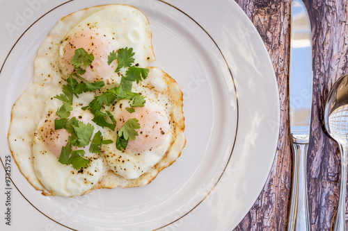Over-easy eggs with fresh slasa and coffee