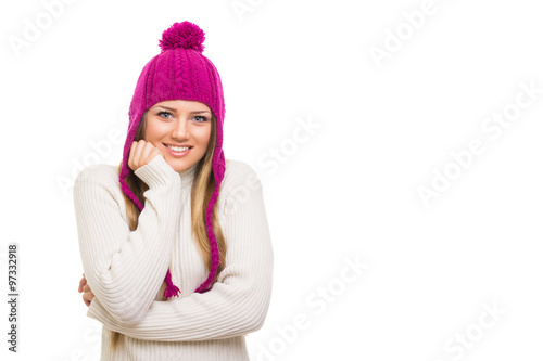 Beautiful blonde teenage girl in pink knitted beanie hat