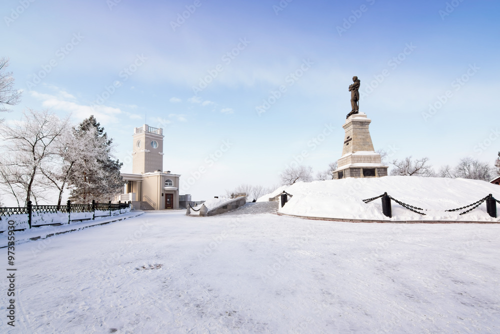 The historical building and the monument of Count Nikolai Muravyov-Amursky at the embankment of Amur River in Khabarovsk, Russia