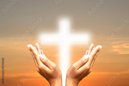 Hands, bless the cross in the sky. photo